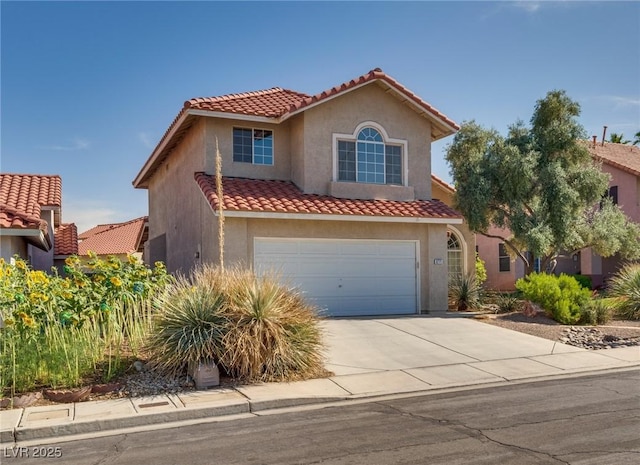 8771 Martinique Bay Ln, Las Vegas, NV 89147 - mediterranean / spanish house featuring a tile roof, an attached garage, concrete driveway, and stucco siding