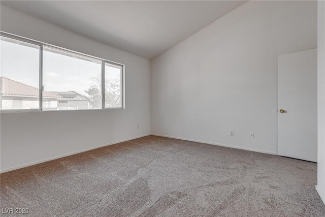8771 Martinique Bay Ln, Las Vegas, NV 89147 - empty room featuring vaulted ceiling and carpet floors