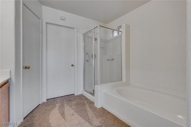 8771 Martinique Bay Ln, Las Vegas, NV 89147 - bathroom featuring a shower stall, a bath, vanity, and carpet flooring