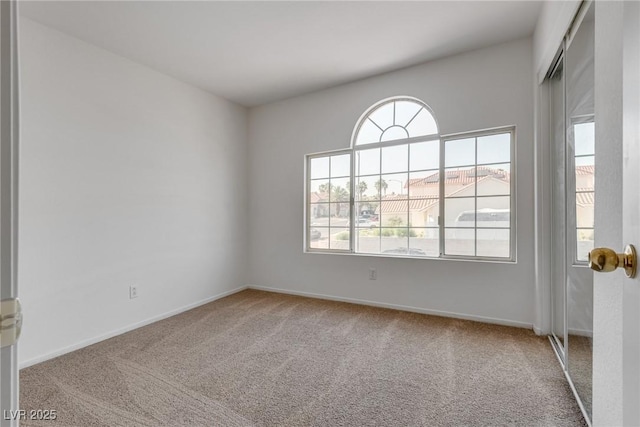 8771 Martinique Bay Ln, Las Vegas, NV 89147 - unfurnished room featuring plenty of natural light and carpet flooring