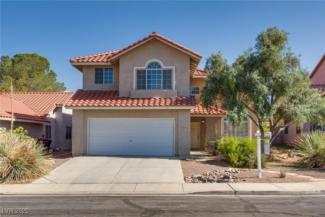 8771 Martinique Bay Ln, Las Vegas, NV 89147 - mediterranean / spanish house featuring concrete driveway, stucco siding, a tiled roof, and a garage