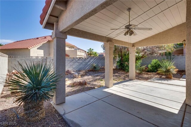 8771 Martinique Bay Ln, Las Vegas, NV 89147 - fenced backyard featuring a ceiling fan and a patio