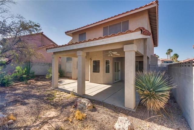 8771 Martinique Bay Ln, Las Vegas, NV 89147 - back of property featuring stucco siding, ceiling fan, a fenced backyard, a tile roof, and a patio