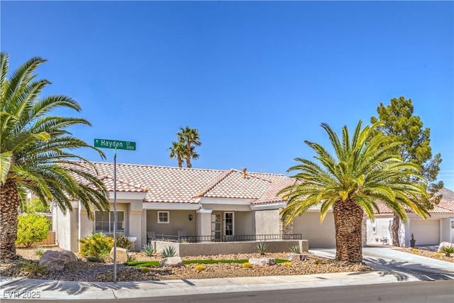 3101 Hayden Ct, Las Vegas, NV 89134 - view of front of property featuring an attached garage, stucco siding, driveway, and a tile roof
