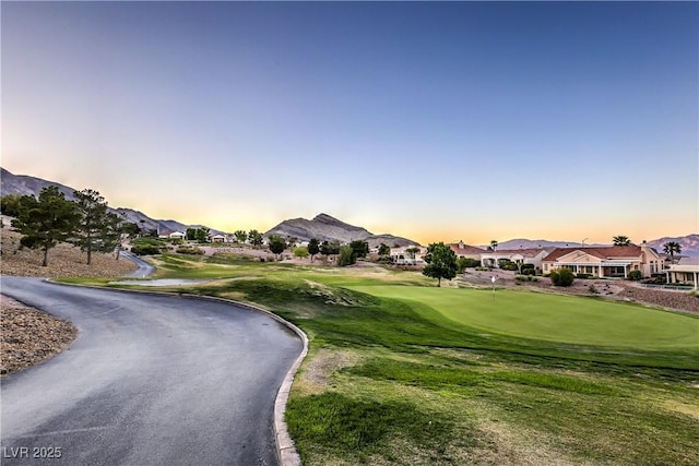 3101 Hayden Ct, Las Vegas, NV 89134 - view of home's community featuring a residential view, golf course view, a putting green, and a mountain view