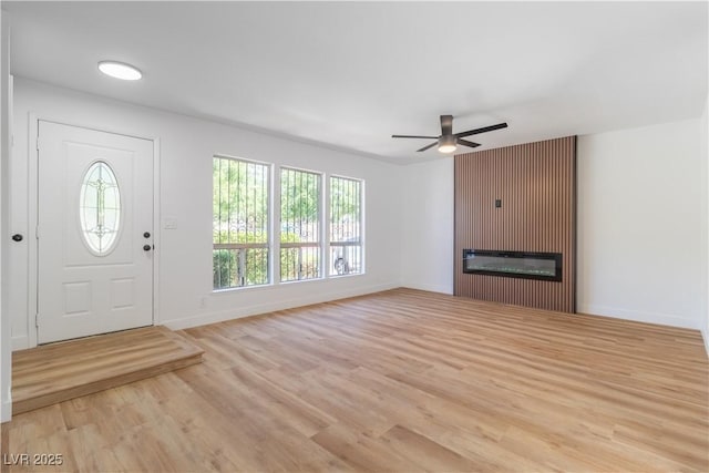3459 One Nation Ave, Las Vegas, NV 89121 - entryway featuring wood finished floors, ceiling fan, and a large fireplace