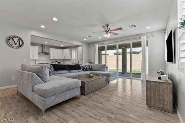 7456 Tinley Creek Ave, Las Vegas, NV 89113 - living room featuring a ceiling fan, light wood-style flooring, and recessed lighting