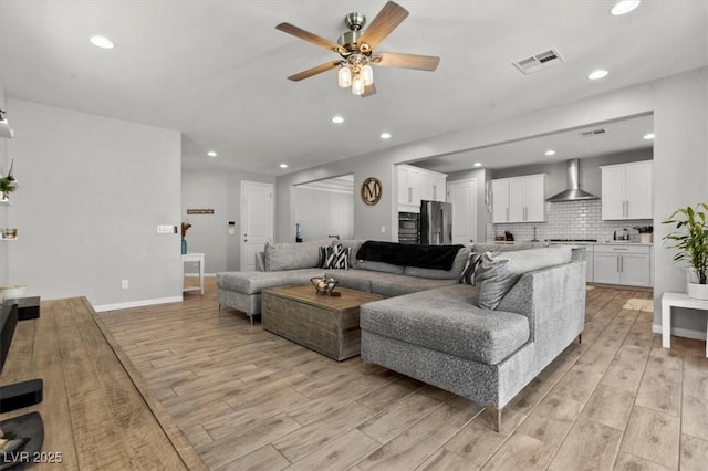7456 Tinley Creek Ave, Las Vegas, NV 89113 - living room with a ceiling fan, light wood-type flooring, and recessed lighting