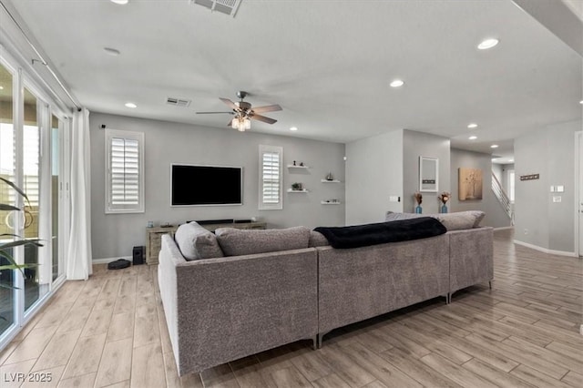 7456 Tinley Creek Ave, Las Vegas, NV 89113 - living area with ceiling fan, light wood-style floors, healthy amount of natural light, and recessed lighting