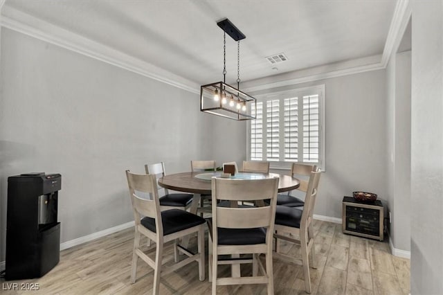 7456 Tinley Creek Ave, Las Vegas, NV 89113 - dining space featuring wood finished floors and ornamental molding