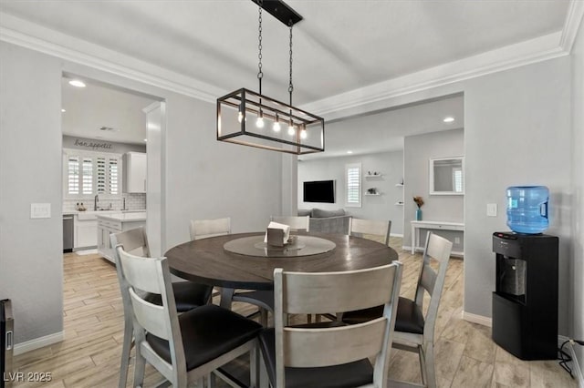 7456 Tinley Creek Ave, Las Vegas, NV 89113 - dining space featuring crown molding, recessed lighting, and light wood finished floors