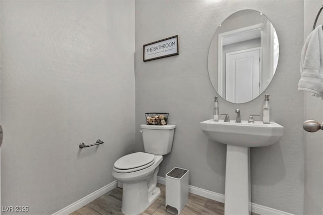 7456 Tinley Creek Ave, Las Vegas, NV 89113 - bathroom featuring toilet and wood finished floors