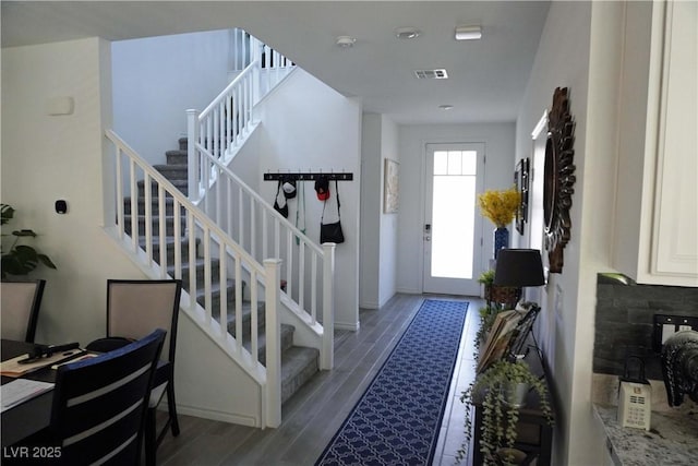 8131 Skye Plum St, Las Vegas, NV 89166 - foyer entrance with stairway and wood finished floors