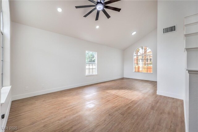 2107 Fountain Springs Dr, Henderson, NV 89074 - unfurnished living room with ceiling fan, wood finished floors, recessed lighting, and high vaulted ceiling