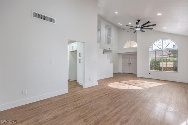2107 Fountain Springs Dr, Henderson, NV 89074 - unfurnished living room featuring a high ceiling, light wood-style flooring, ceiling fan, and recessed lighting