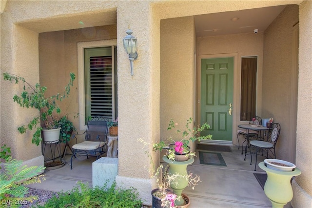 2026 Poppywood Ave, Henderson, NV 89012 - view of exterior entry with stucco siding and a security system