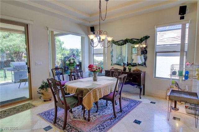 2026 Poppywood Ave, Henderson, NV 89012 - dining space with a chandelier, light tile patterned floors, and a raised ceiling