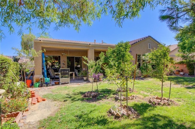 2026 Poppywood Ave, Henderson, NV 89012 - rear view of property featuring stucco siding, a lawn, a patio, and ceiling fan