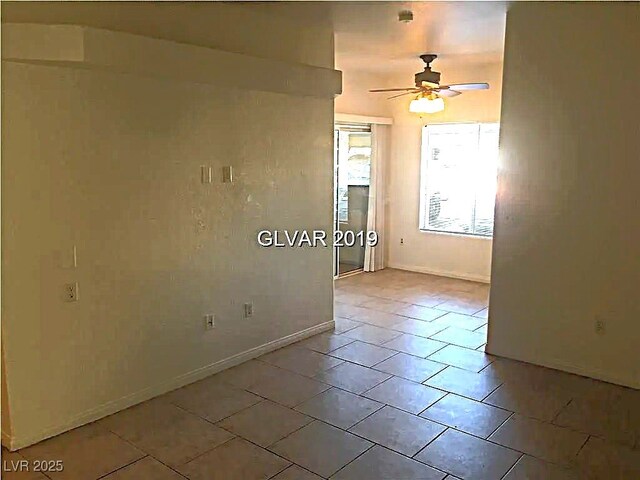 8417 Running Deer Ave Unit 101, Las Vegas, NV 89145 - spare room with ceiling fan and light tile patterned flooring