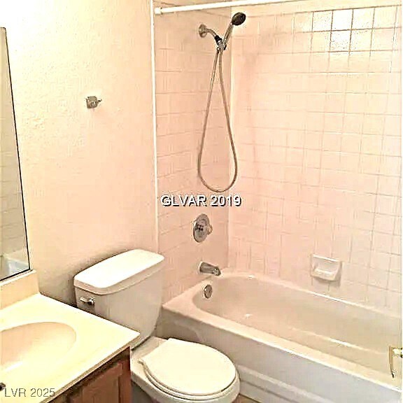 8417 Running Deer Ave Unit 101, Las Vegas, NV 89145 - bathroom with vanity and shower / washtub combination