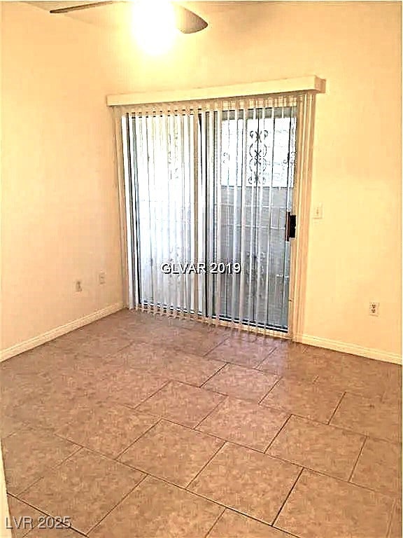 8417 Running Deer Ave Unit 101, Las Vegas, NV 89145 - unfurnished room with baseboards and tile patterned floors