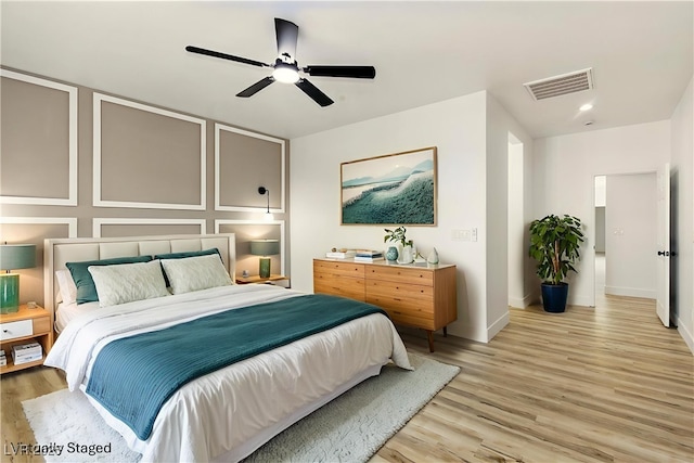 10302 Artful Stone Ave, Las Vegas, NV 89149 - bedroom with light wood-style flooring and a ceiling fan