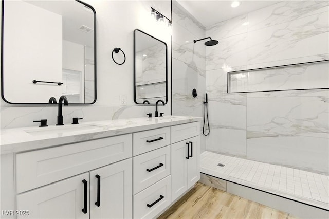 10302 Artful Stone Ave, Las Vegas, NV 89149 - bathroom with a marble finish shower, double vanity, and wood finished floors