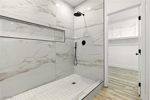 10302 Artful Stone Ave, Las Vegas, NV 89149 - bathroom with a marble finish shower, wood finished floors, and a walk in closet