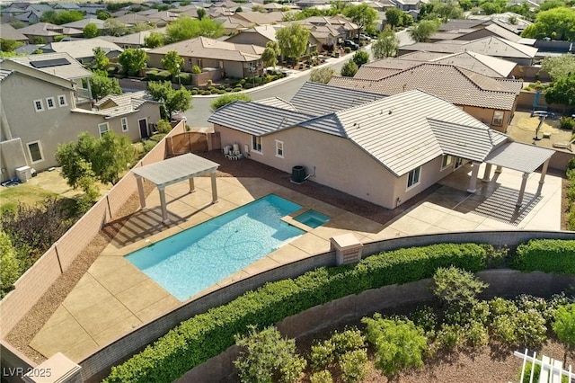 10302 Artful Stone Ave, Las Vegas, NV 89149 - view of pool featuring a residential view, a pool with connected hot tub, a patio, and a fenced backyard