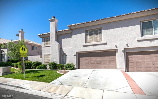 507 Satin Saddle Pl, Henderson, NV 89052 - mediterranean / spanish home featuring a chimney, stucco siding, a garage, concrete driveway, and a front lawn