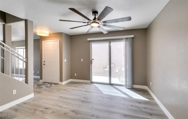 507 Satin Saddle Pl, Henderson, NV 89052 - spare room with a ceiling fan, light wood-style flooring, plenty of natural light, and stairs