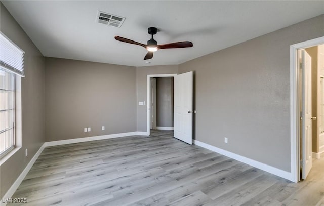 507 Satin Saddle Pl, Henderson, NV 89052 - unfurnished bedroom with light wood-style floors, ceiling fan, and ensuite bathroom