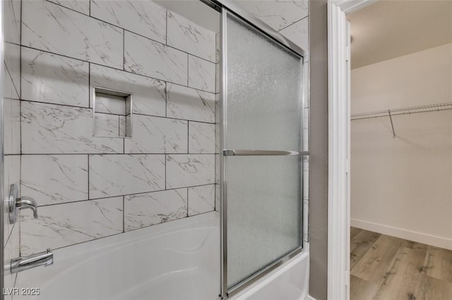 507 Satin Saddle Pl, Henderson, NV 89052 - full bathroom featuring combined bath / shower with glass door, wood finished floors, and a spacious closet