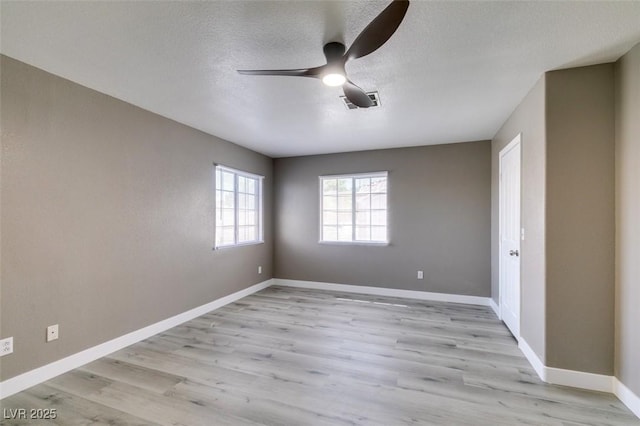 507 Satin Saddle Pl, Henderson, NV 89052 - empty room with light wood-style floors, ceiling fan, and a textured ceiling