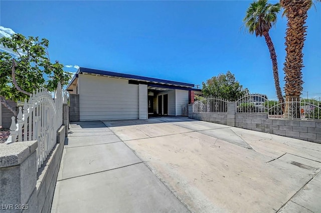 4807 Sacks Dr, Las Vegas, NV 89122 - back of property featuring driveway and a carport