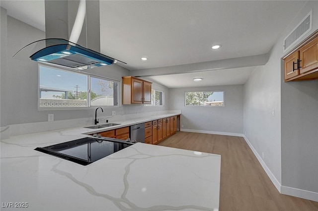 4807 Sacks Dr, Las Vegas, NV 89122 - kitchen featuring island exhaust hood, brown cabinets, light wood-style floors, light stone counters, and dishwasher