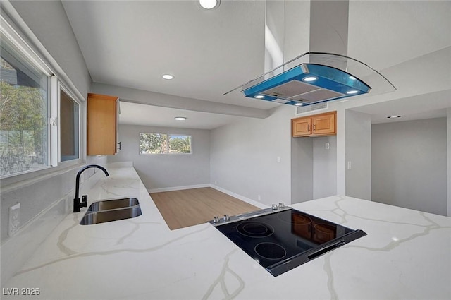 4807 Sacks Dr, Las Vegas, NV 89122 - kitchen featuring island range hood, light wood finished floors, light stone countertops, recessed lighting, and electric range