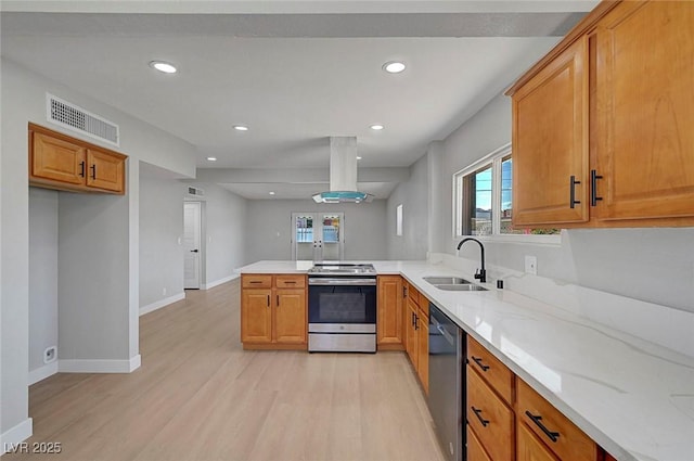 4807 Sacks Dr, Las Vegas, NV 89122 - kitchen featuring stainless steel appliances, light wood finished floors, a peninsula, brown cabinetry, and island range hood