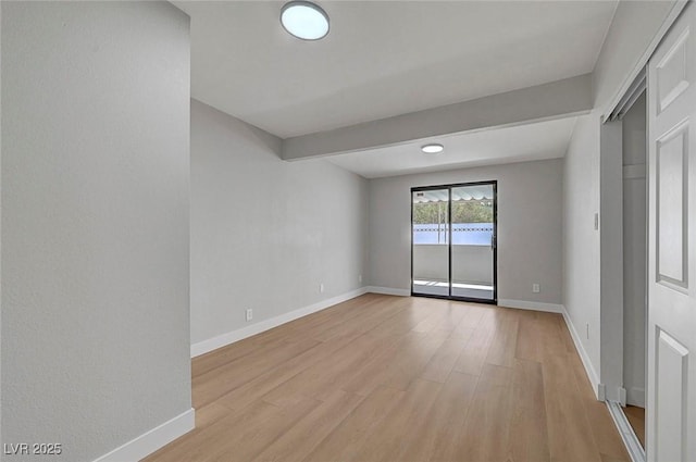 4807 Sacks Dr, Las Vegas, NV 89122 - spare room featuring light wood-style flooring and baseboards
