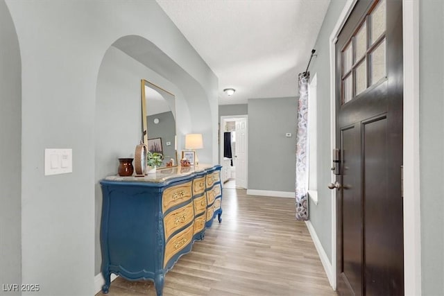5008 Donnie Ave, Las Vegas, NV 89130 - foyer with light wood-style flooring and arched walkways