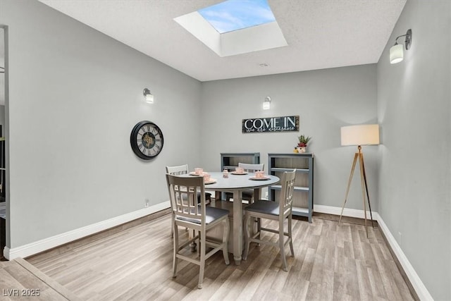 5008 Donnie Ave, Las Vegas, NV 89130 - dining room with wood finished floors and a skylight