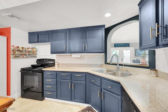 5008 Donnie Ave, Las Vegas, NV 89130 - kitchen featuring black electric range oven, arched walkways, light countertops, light wood-style floors, and blue cabinets