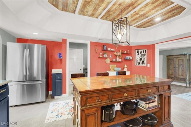 5008 Donnie Ave, Las Vegas, NV 89130 - kitchen with freestanding refrigerator, wooden ceiling, recessed lighting, pendant lighting, and a tray ceiling