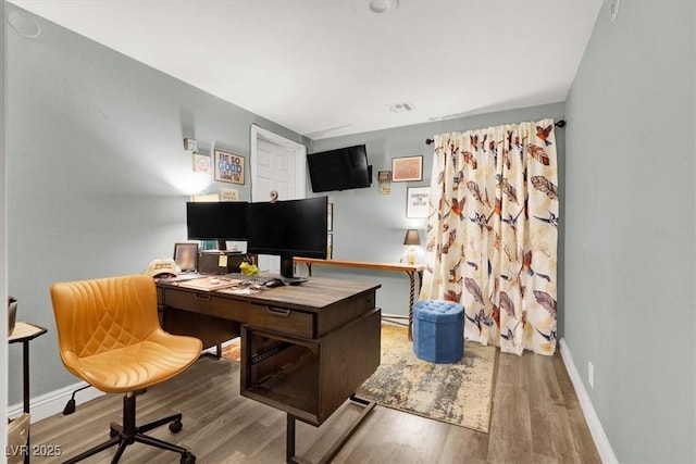 5008 Donnie Ave, Las Vegas, NV 89130 - home office with wood finished floors and baseboards