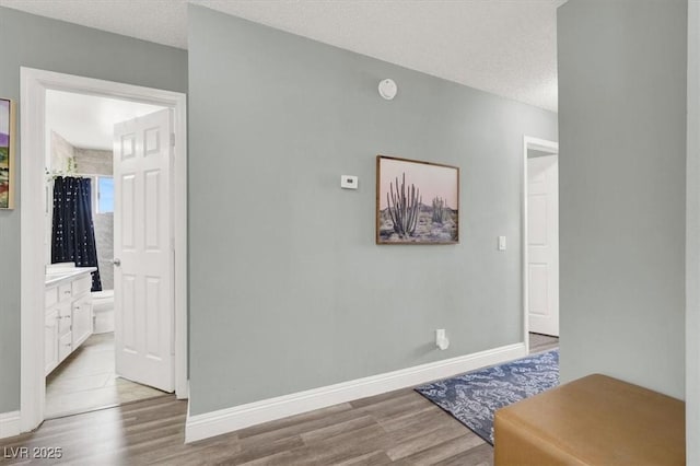 5008 Donnie Ave, Las Vegas, NV 89130 - hallway featuring wood finished floors and a textured ceiling