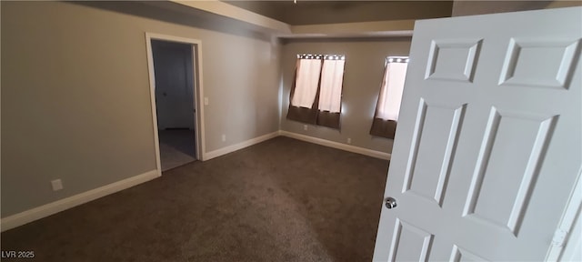 5008 Donnie Ave, Las Vegas, NV 89130 - spare room with dark colored carpet and baseboards