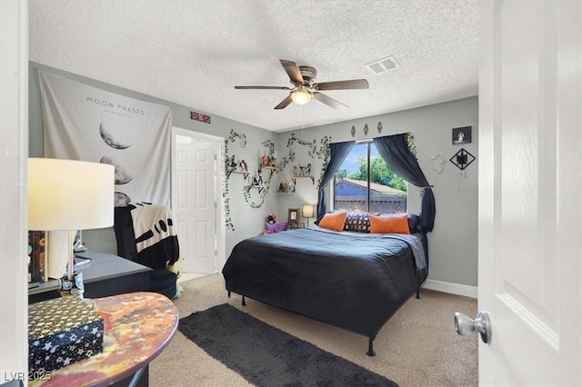 5008 Donnie Ave, Las Vegas, NV 89130 - carpeted bedroom featuring a textured ceiling and a ceiling fan