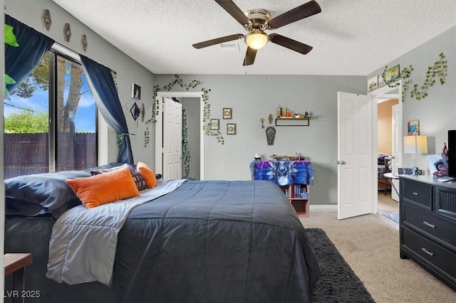 5008 Donnie Ave, Las Vegas, NV 89130 - bedroom featuring light colored carpet, a textured ceiling, and a ceiling fan