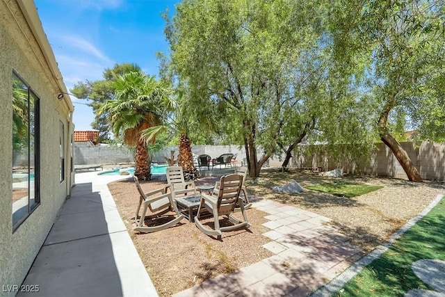 5008 Donnie Ave, Las Vegas, NV 89130 - fenced backyard with a patio and a fire pit
