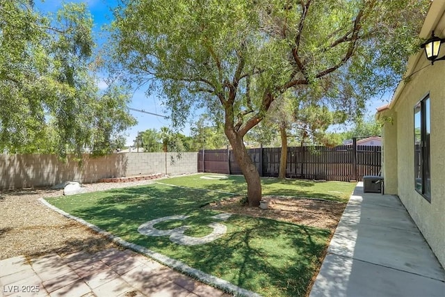 5008 Donnie Ave, Las Vegas, NV 89130 - fenced backyard featuring a patio